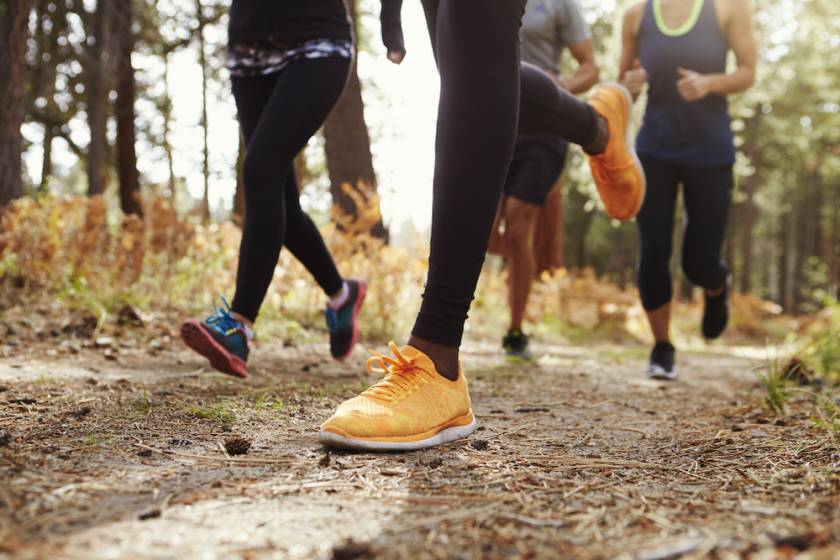 close up of runner's feet as they jog in a race